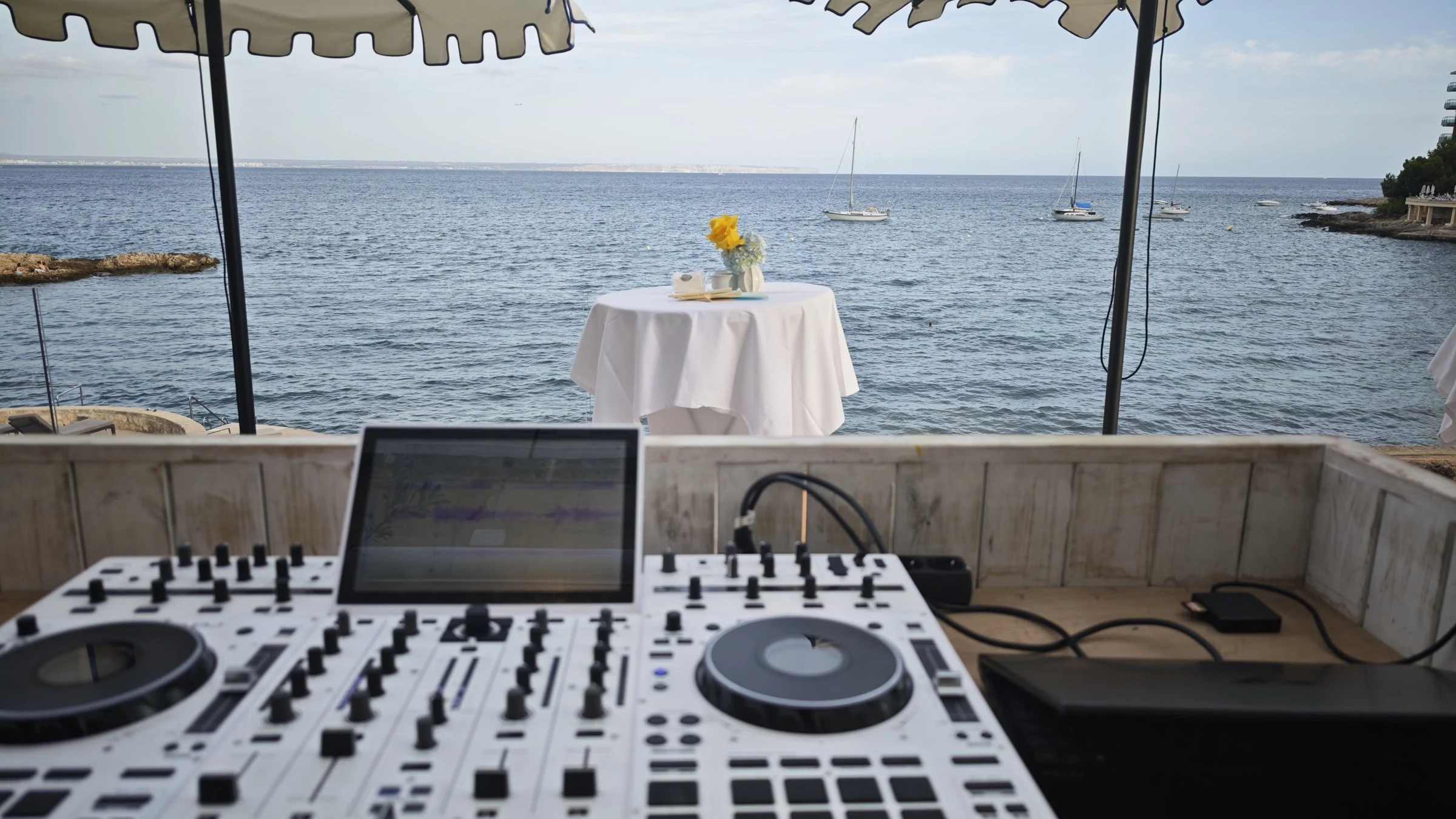 White Denon Prime DJ controller overlooking the sea in Portals Nous