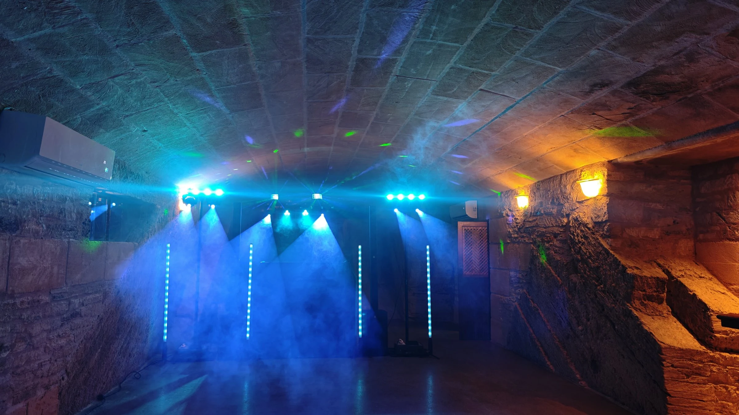Light show with moving heads, LED tubes and haze over the dance floor in Santa Margalida