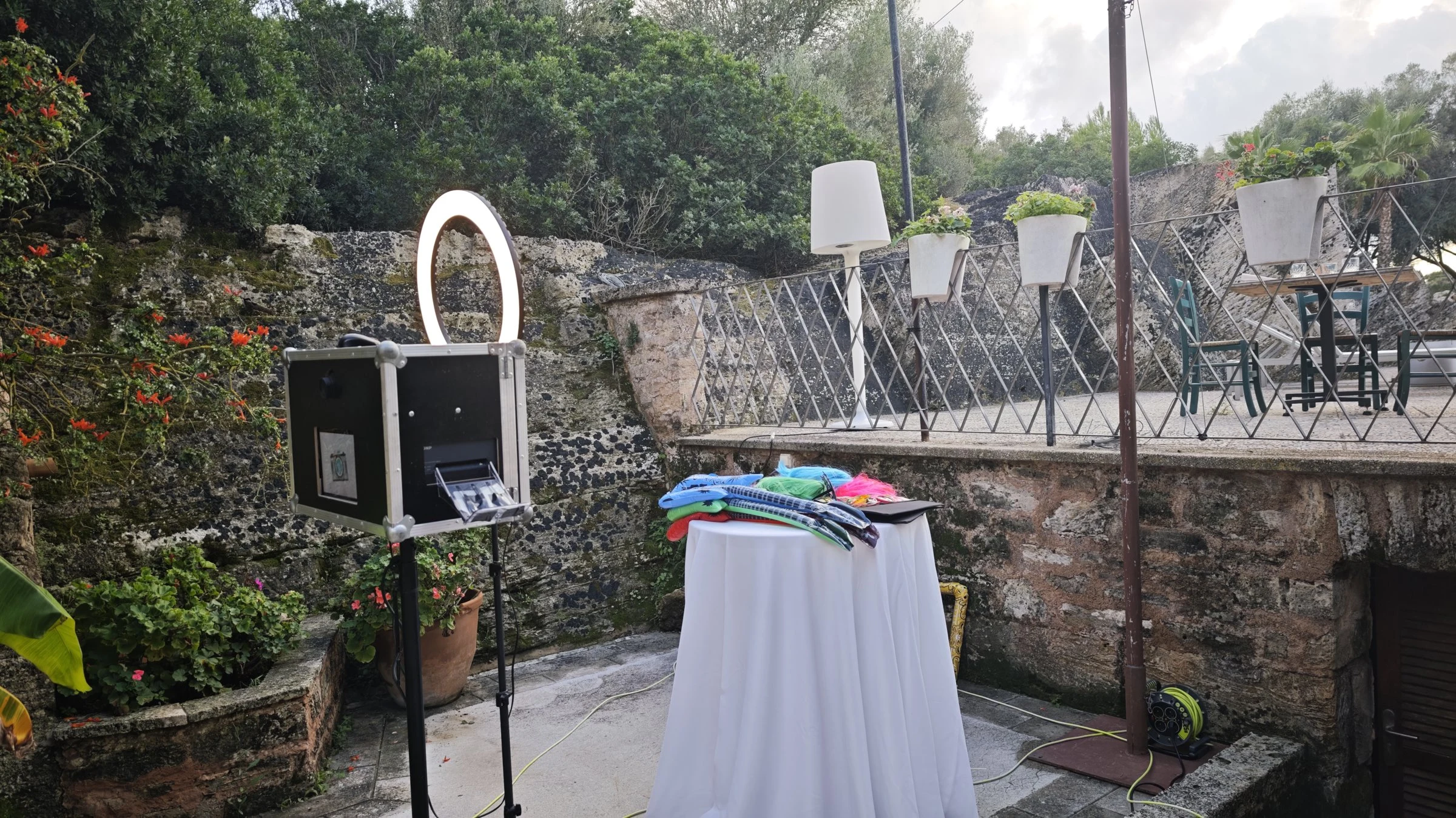 Photo booth with ring light and props table on a terrace in Santa Margalida