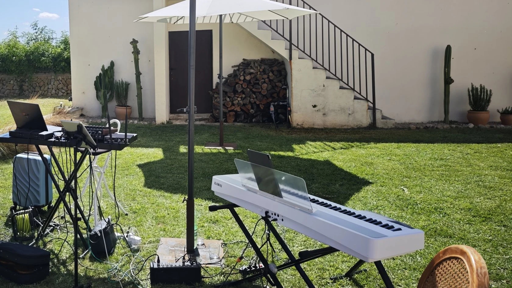 Ceremony setup in a finca garden with Kawai keyboard, mixer and microphone in Manacor
